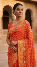 Orange Leheriya Georgette Saree with Gold Zari Border & Blouse Piece